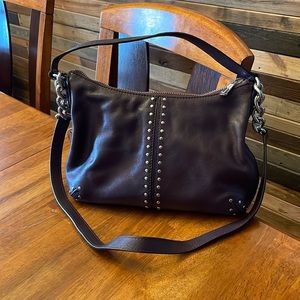 Plum colored Michael Kors hand bag.
